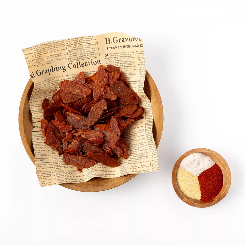 
                  
                    Crunchy BBQ chicken chips served in a rustic bowl with dipping sauce – savory high-protein snack alternative
                  
                